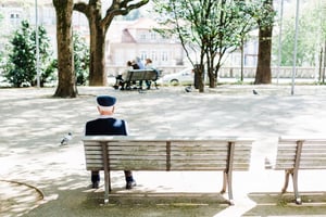 Man on bench in city