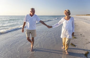 active seniors in retirement on the beach