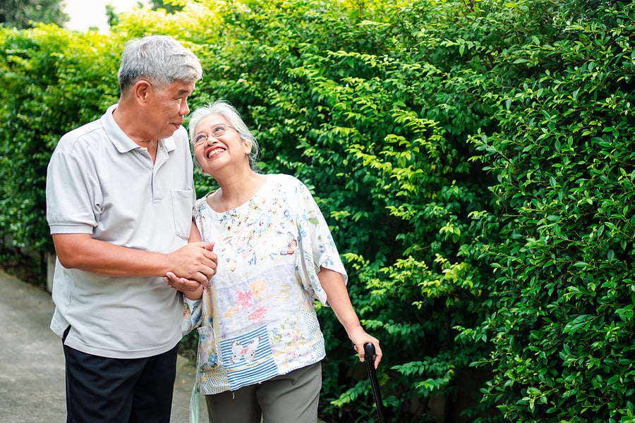 bigstock-Happy-Senior-Couple-Walking-To-425962037