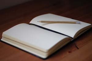 journal and pencil on desk