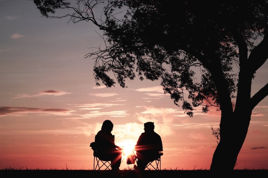 two people in front of the sunset retirement