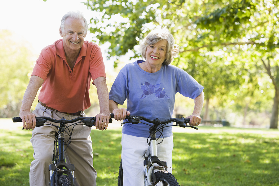 senior couple riding bikes