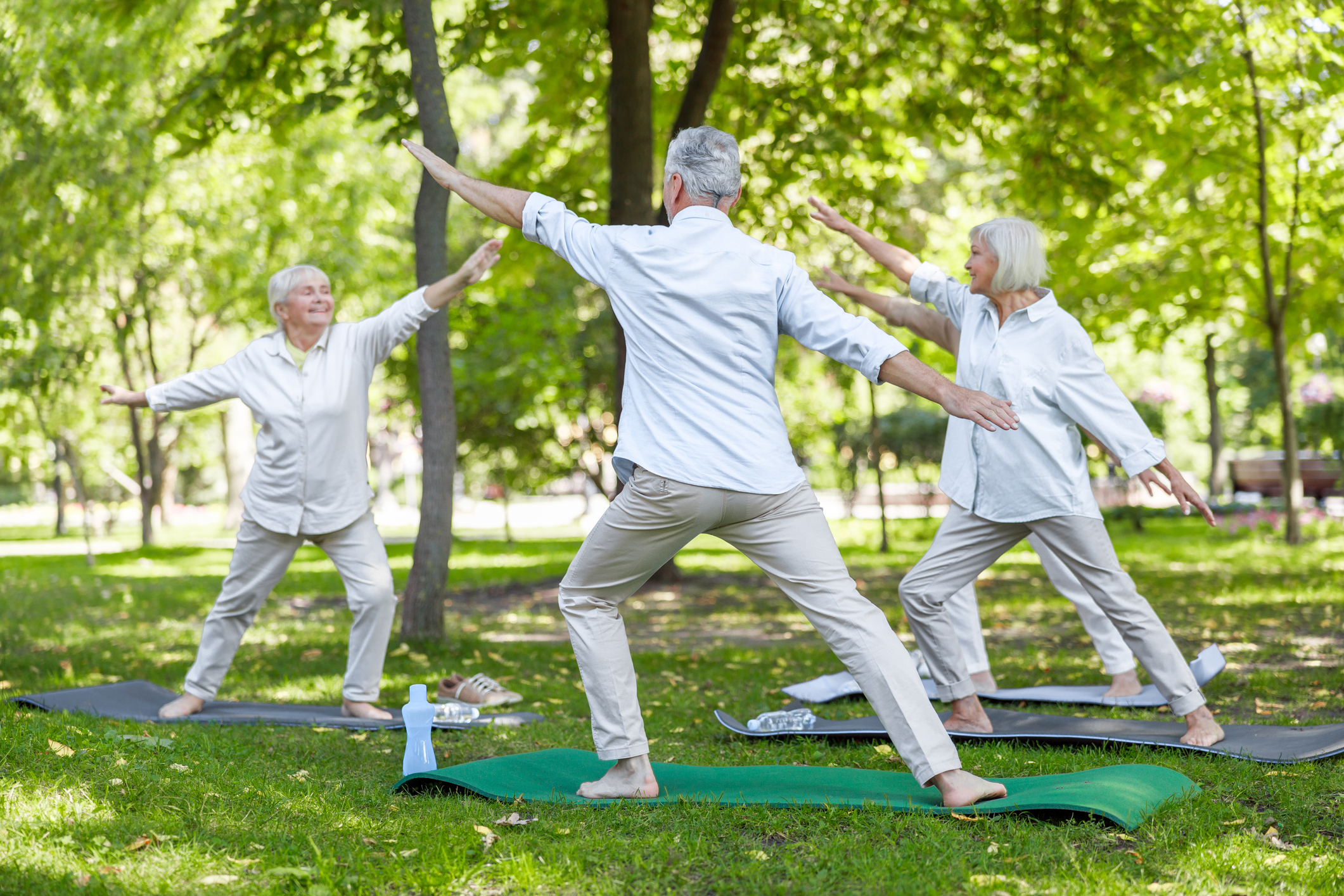Older adults practicing Tai Chi at a waterfront senior living community